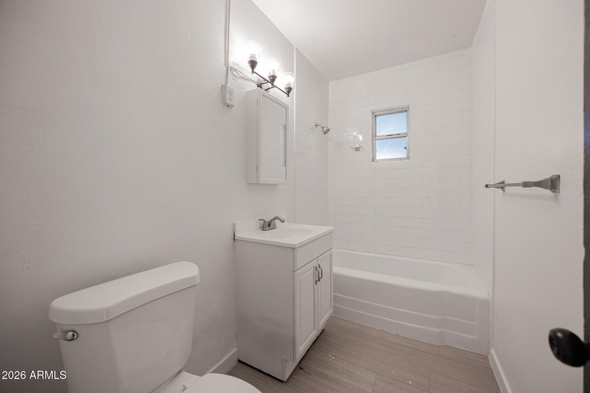 414 West 13th Street Tempe, AZ 85281 - Photo 13 of 21 a bathroom with a sink a toilet and shower