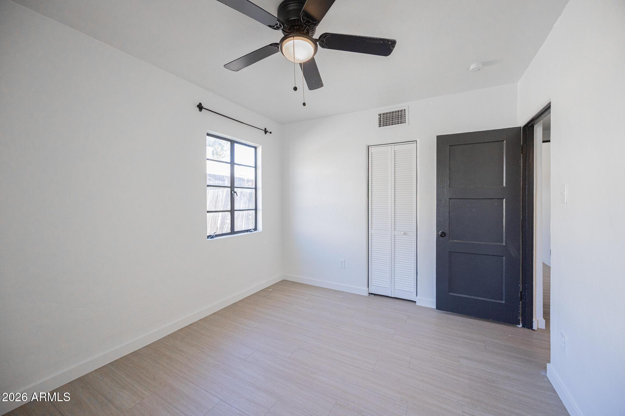 414 West 13th Street Tempe, AZ 85281 - Photo 15 of 21 a view of an empty room with a window