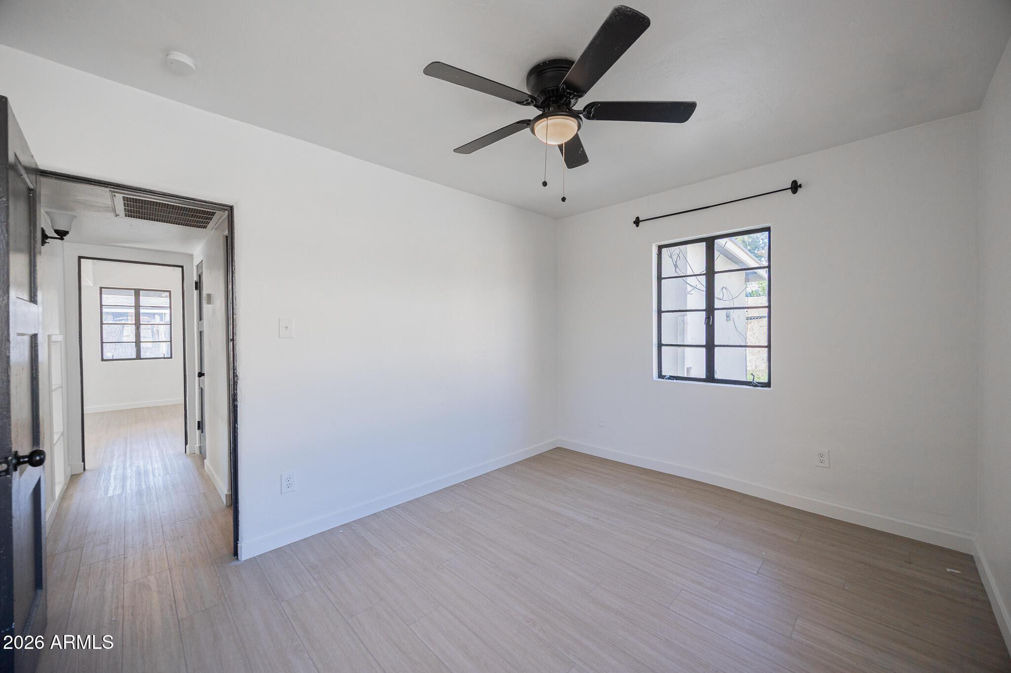414 West 13th Street Tempe, AZ 85281 - Photo 16 of 21 wooden floor in an empty room with a window
