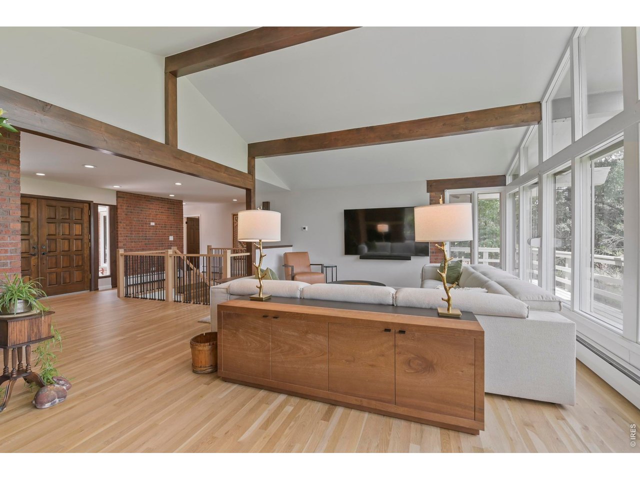 19 Ridge Road Boulder, CO 80303 - Photo 13 of 49 New white oak flooring unites the living, dining, and kitchen areas.