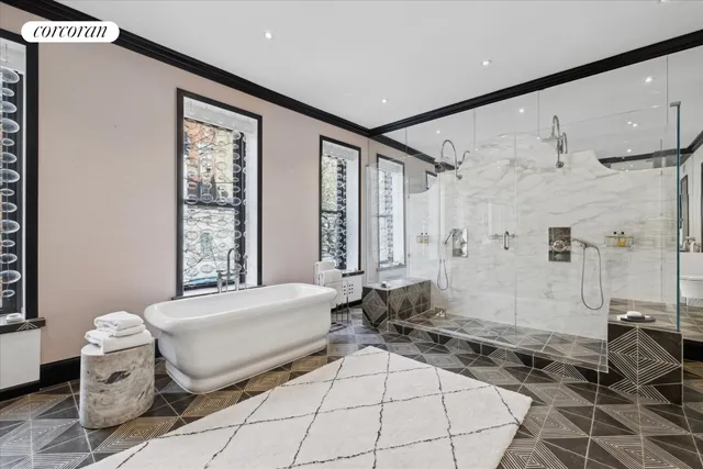 a spacious bedroom with a bed and a window