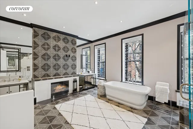 a spacious bedroom with a bed and a couch