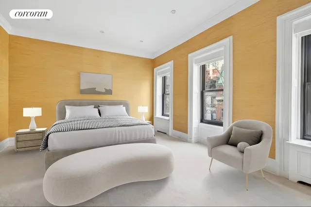 a bedroom with a bed and a couch