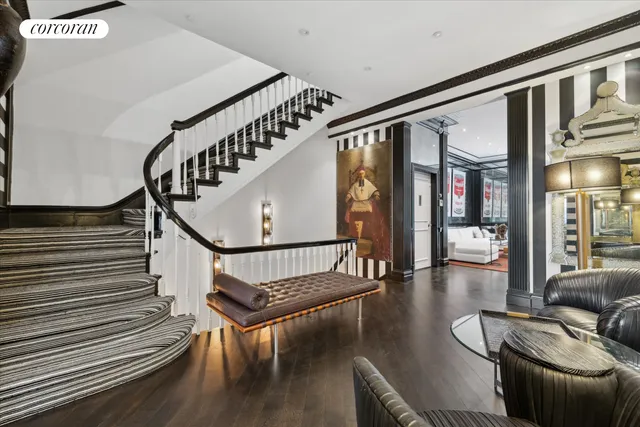 a view of entryway livingroom and hall with wooden floor