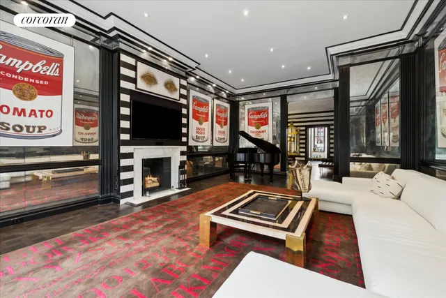 a living room with furniture flat screen tv and a fireplace