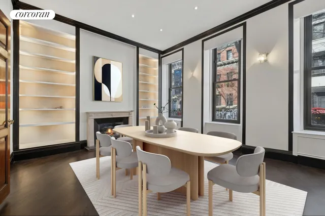 a view of a dining room with furniture and window