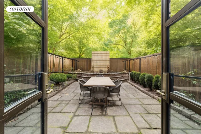 a view of backyard with a patio and outdoor seating