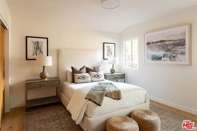 a bathroom with double vanity two mirror and a sink