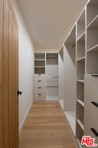 a bathroom with a sink toilet and window
