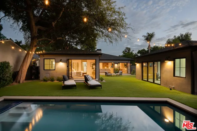 a view of swimming pool with chairs