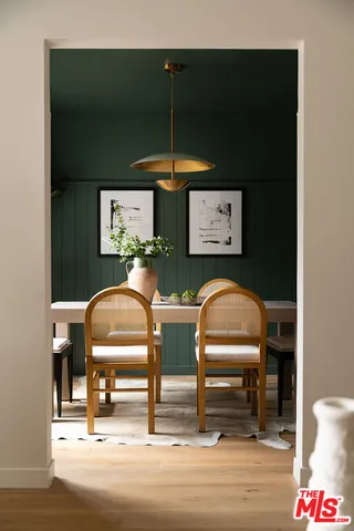 a bedroom with furniture and a mirror