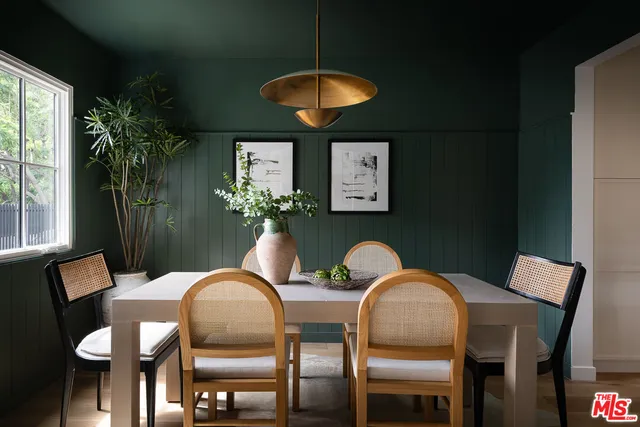 a dining room with furniture and chandelier
