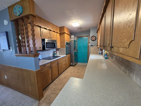 a kitchen with counter top space and a sink