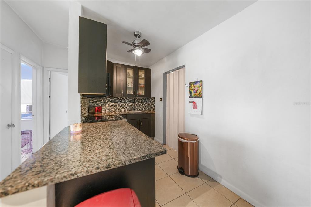 2321 Dallas Street Port Charlotte, FL 33952 - Photo 13 of 38 a kitchen with counter top space cabinets and appliances