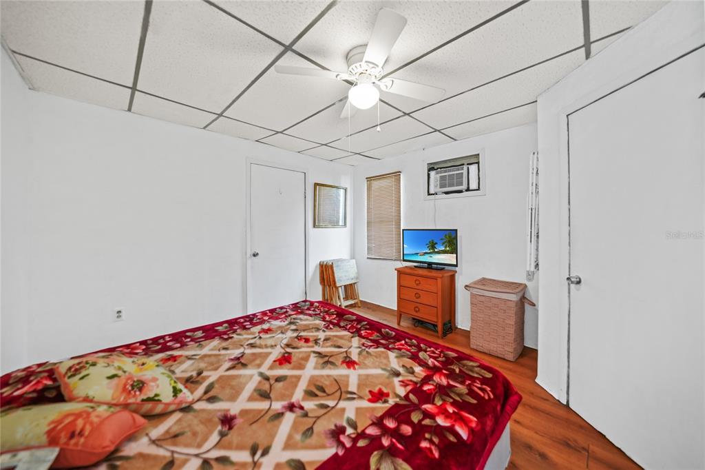 2321 Dallas Street Port Charlotte, FL 33952 - Photo 17 of 38 a bedroom with a bed and a dresser