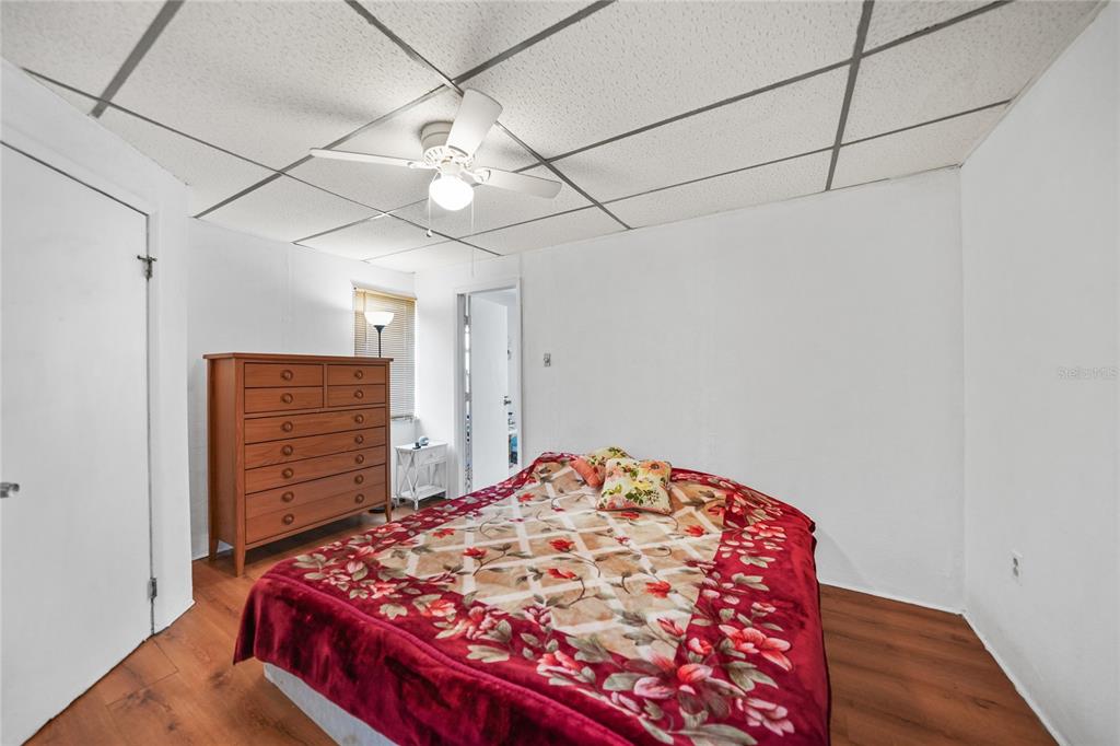 2321 Dallas Street Port Charlotte, FL 33952 - Photo 18 of 38 a bedroom with a bed and a dresser