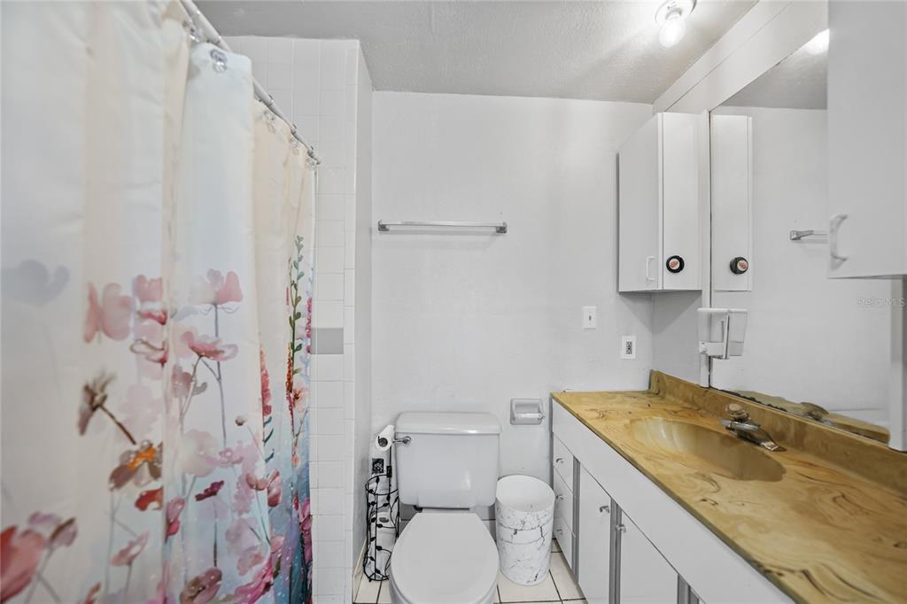 2321 Dallas Street Port Charlotte, FL 33952 - Photo 20 of 38 a bathroom with a granite countertop sink toilet and shower