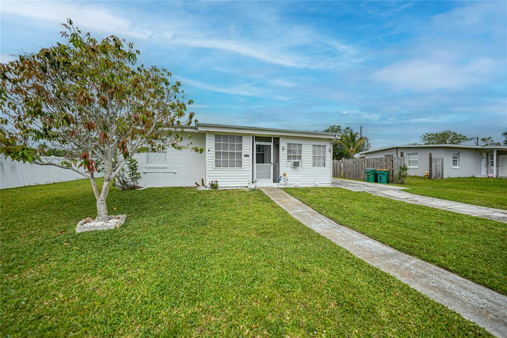 2321 Dallas Street Port Charlotte, FL 33952 - Photo 2 of 38 a front view of house with a garden