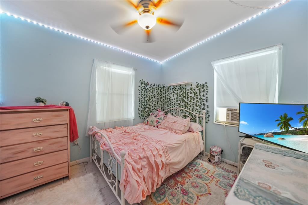 2321 Dallas Street Port Charlotte, FL 33952 - Photo 21 of 38 a bedroom with a bed and a dresser