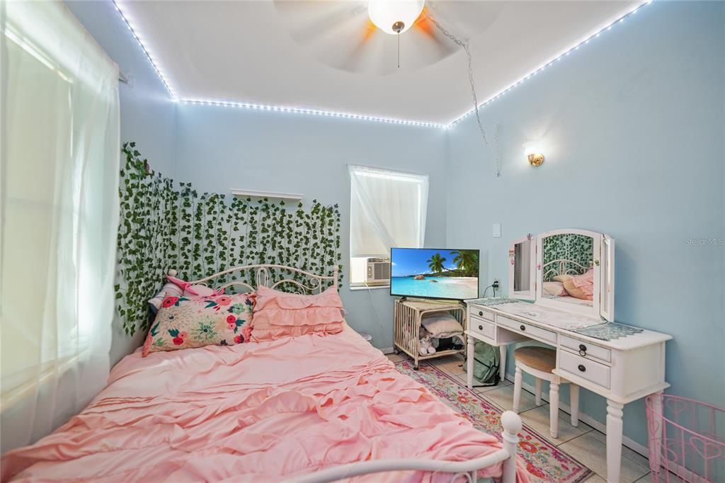 2321 Dallas Street Port Charlotte, FL 33952 - Photo 22 of 38 a bedroom with a bed and a cabinets