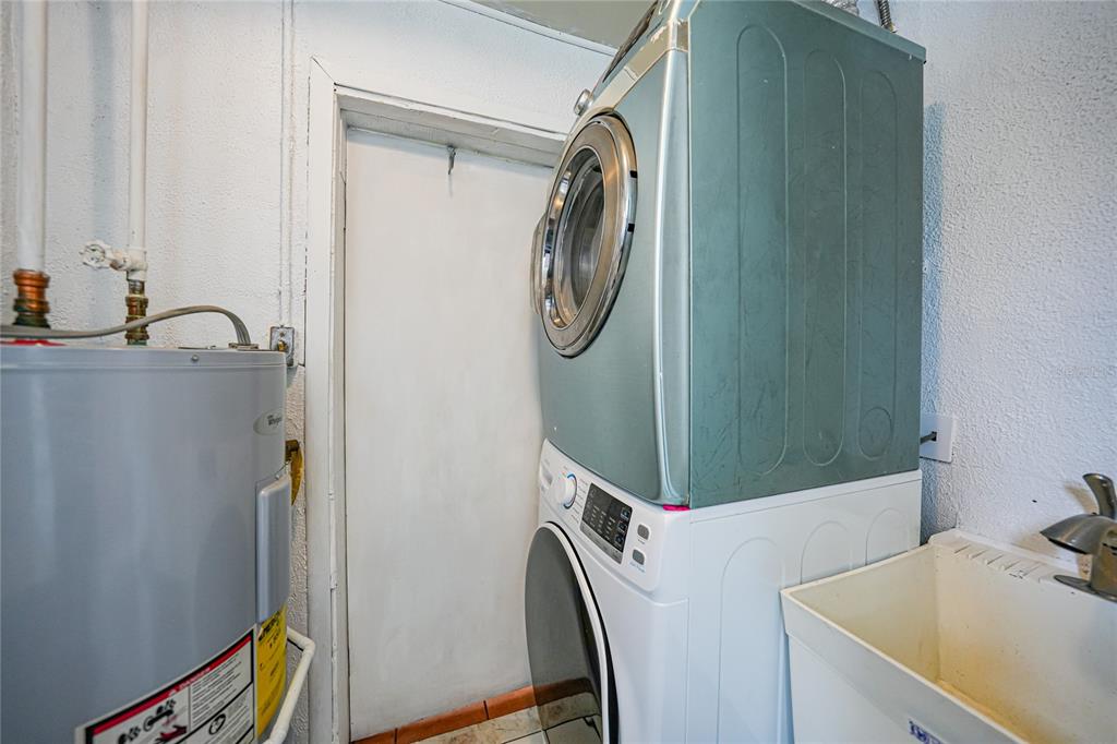 2321 Dallas Street Port Charlotte, FL 33952 - Photo 24 of 38 a utility room with dryer and washer