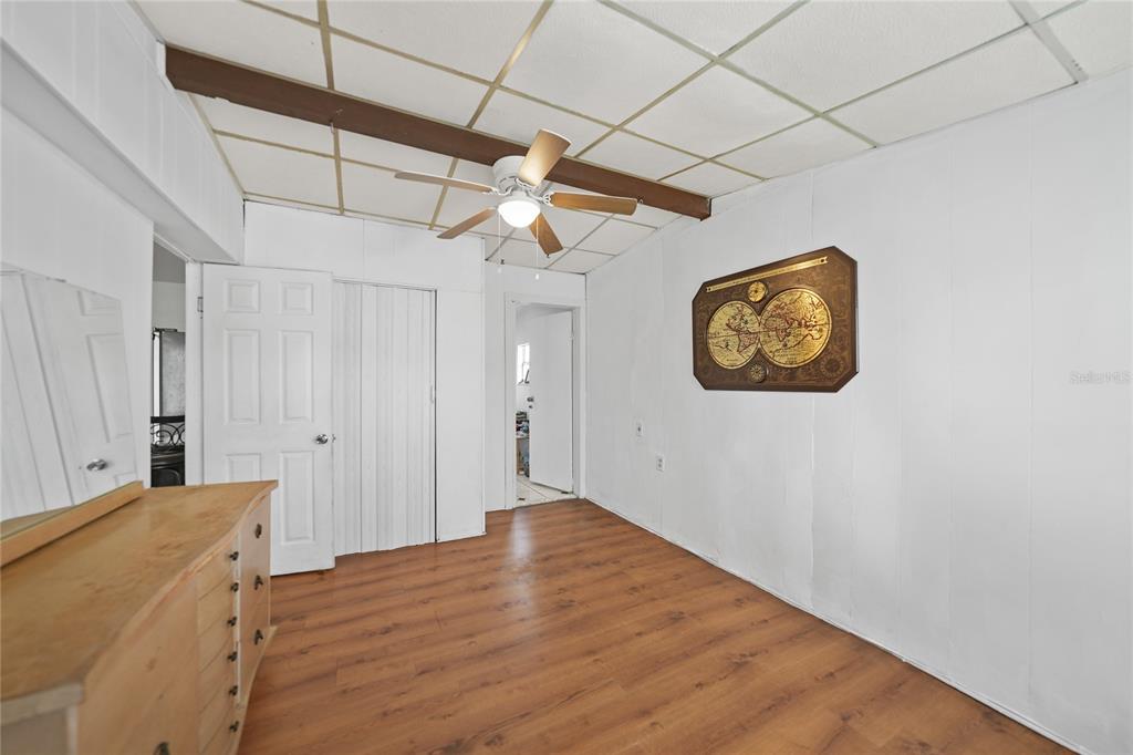 2321 Dallas Street Port Charlotte, FL 33952 - Photo 28 of 38 a bedroom with a bed and a chandelier