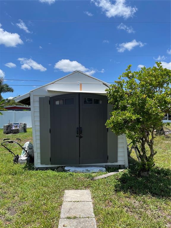 2321 Dallas Street Port Charlotte, FL 33952 - Photo 35 of 38 a backyard of a house with lots of green space