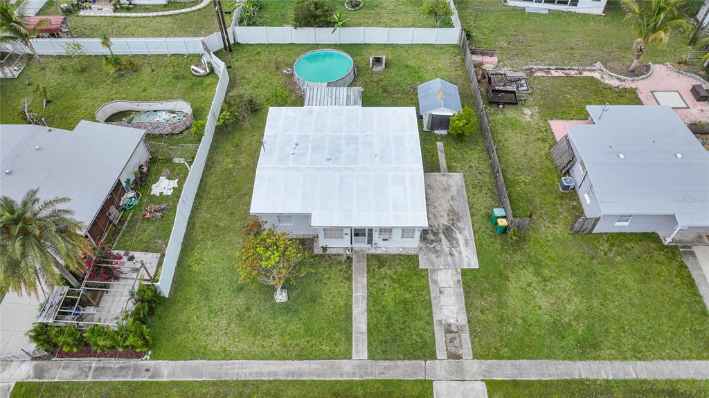 2321 Dallas Street Port Charlotte, FL 33952 - Photo 5 of 38 an aerial view of a house with swimming pool and outdoor seating