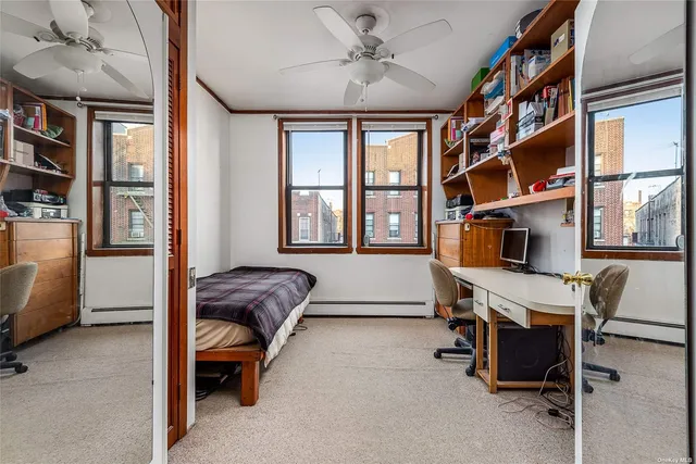 a bedroom with furniture and a window