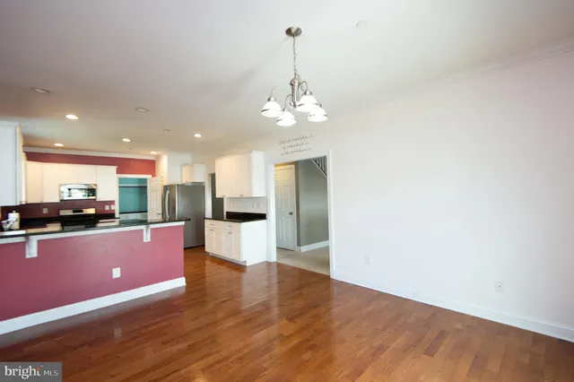 a bathroom with a toilet a sink and a mirror