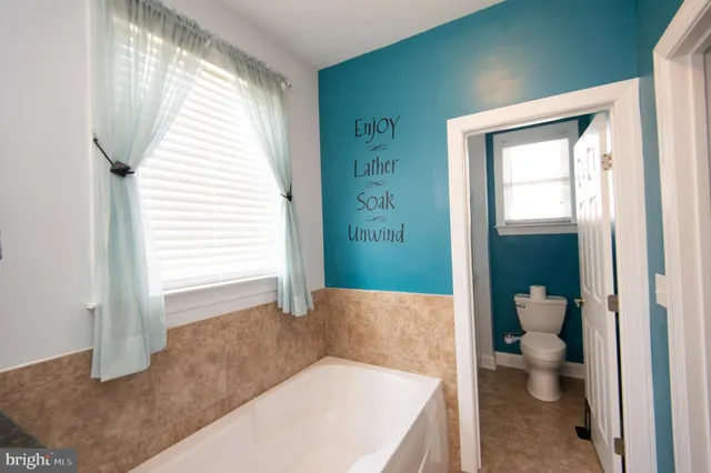 a view of water heater room with stairs