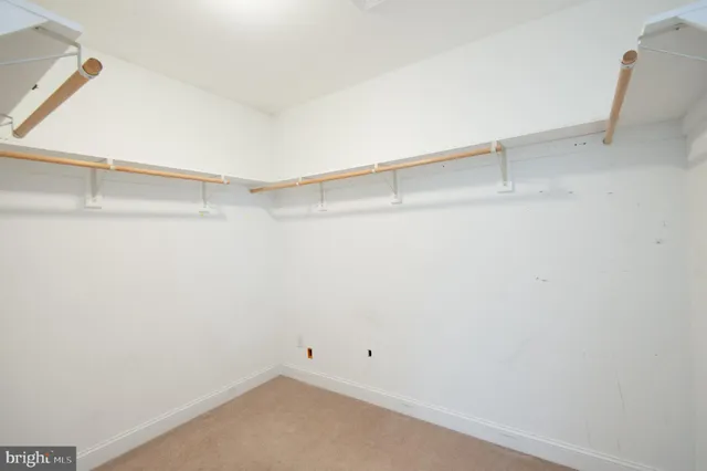 a bathroom with a toilet a sink and vanity