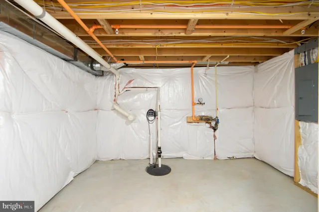 a view of a white house with a yard