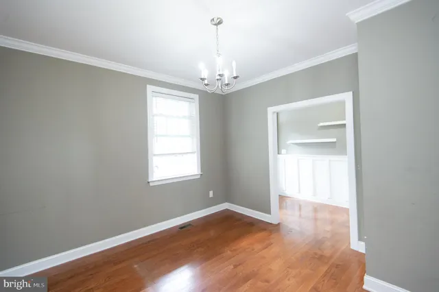 a kitchen with stainless steel appliances granite countertop a refrigerator and a stove