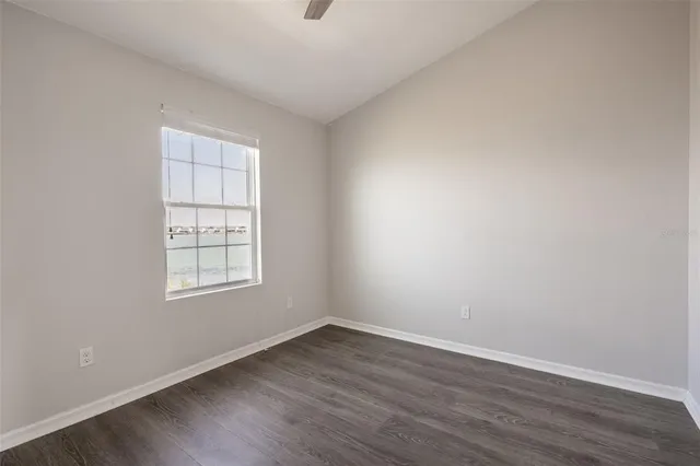 a view of a big room with closet and wooden floor