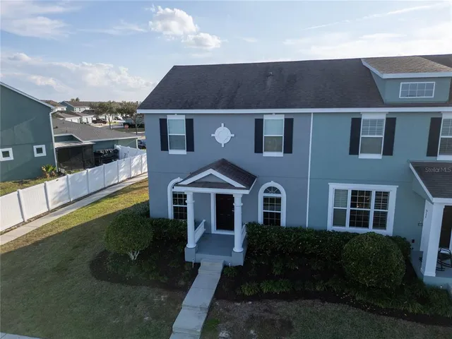 an aerial view of a house with a lake view