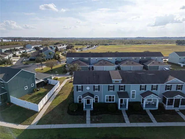 an aerial view of a house with a lake view
