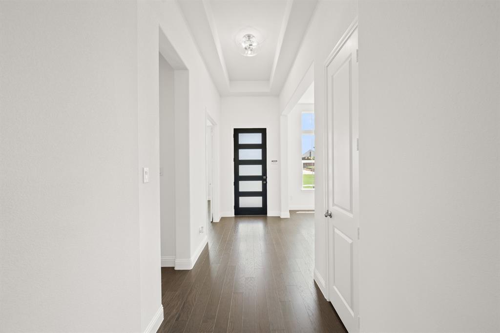 27 Old Crow Road Joshua, TX 76058 - Photo 5 of 35 a view of a hallway with wooden floor