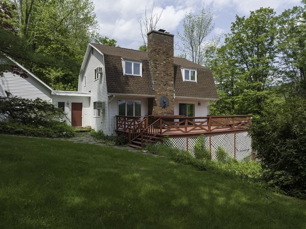 735 North Poland Road Conway, MA 01341 - Photo 1 of 40 a front view of a house with a garden