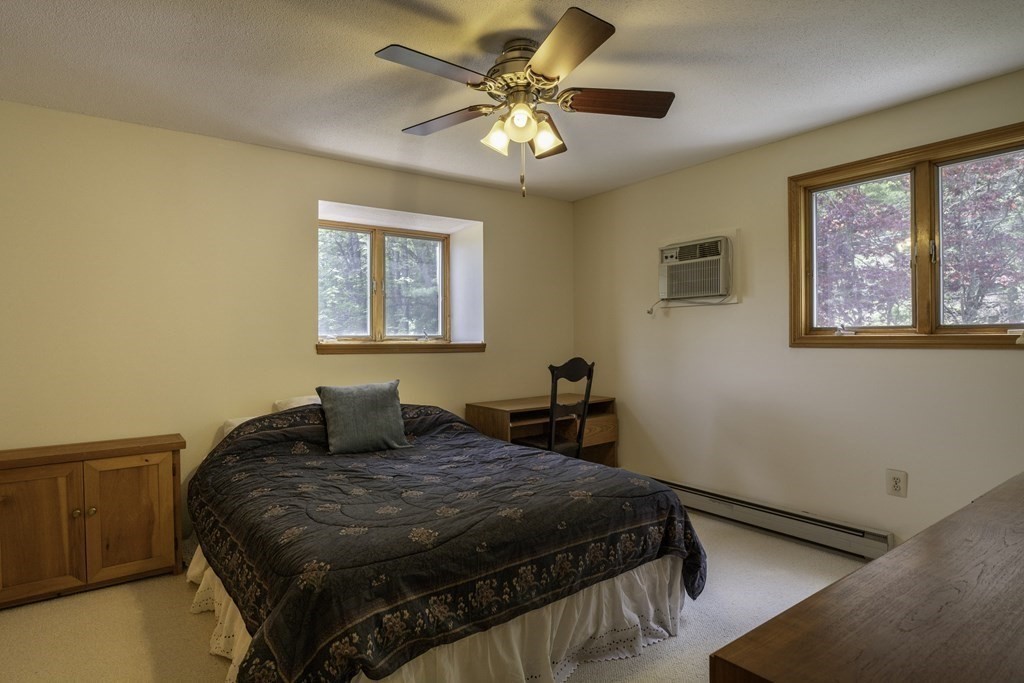 735 North Poland Road Conway, MA 01341 - Photo 15 of 40 a bedroom with a large bed and a window