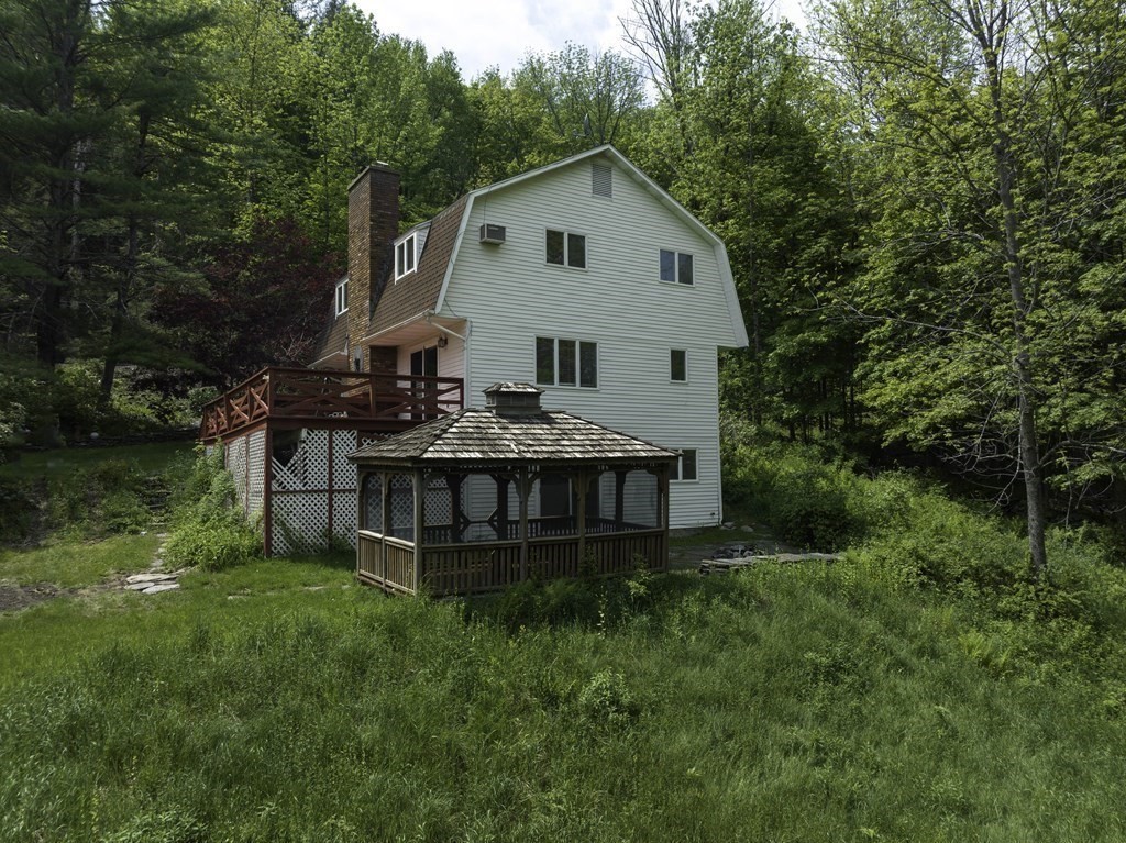 735 North Poland Road Conway, MA 01341 - Photo 27 of 40 a view of a house with a yard and large trees