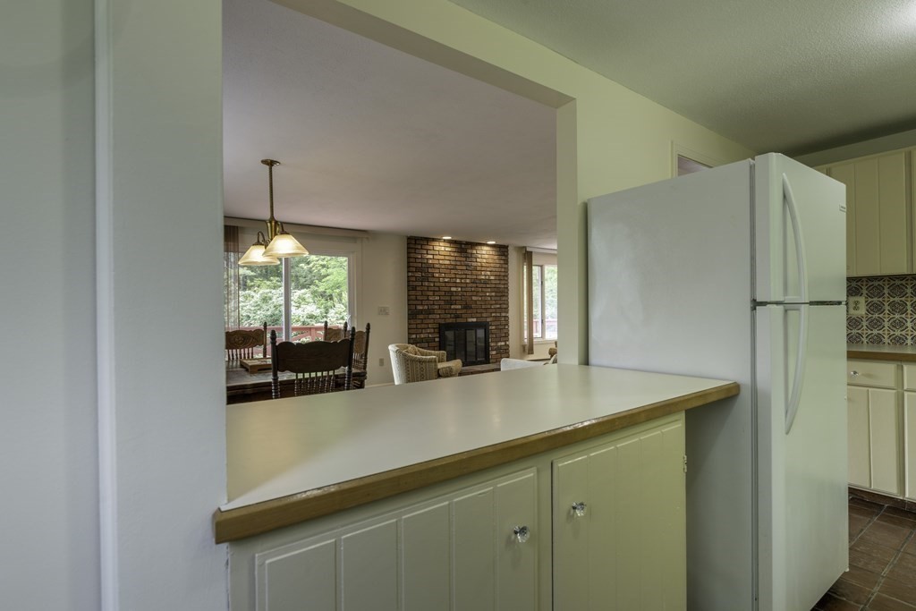 735 North Poland Road Conway, MA 01341 - Photo 9 of 40 a kitchen with stainless steel appliances a refrigerator a sink and a large window