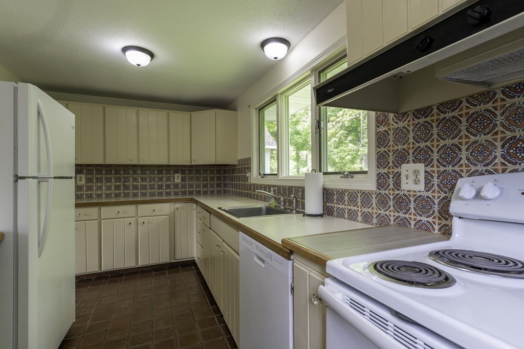 735 North Poland Road Conway, MA 01341 - Photo 10 of 40 a kitchen that has a sink cabinets and window