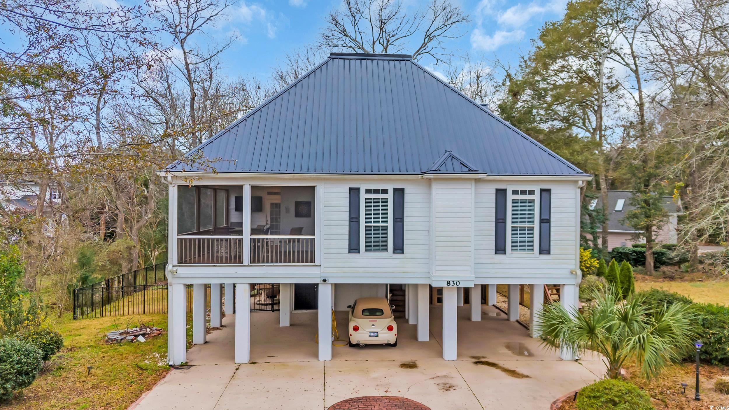 830 Channel Cat Cove Murrells Inlet, SC 29576 - Photo 1 of 40 View of front of home with a carport and a sunroom