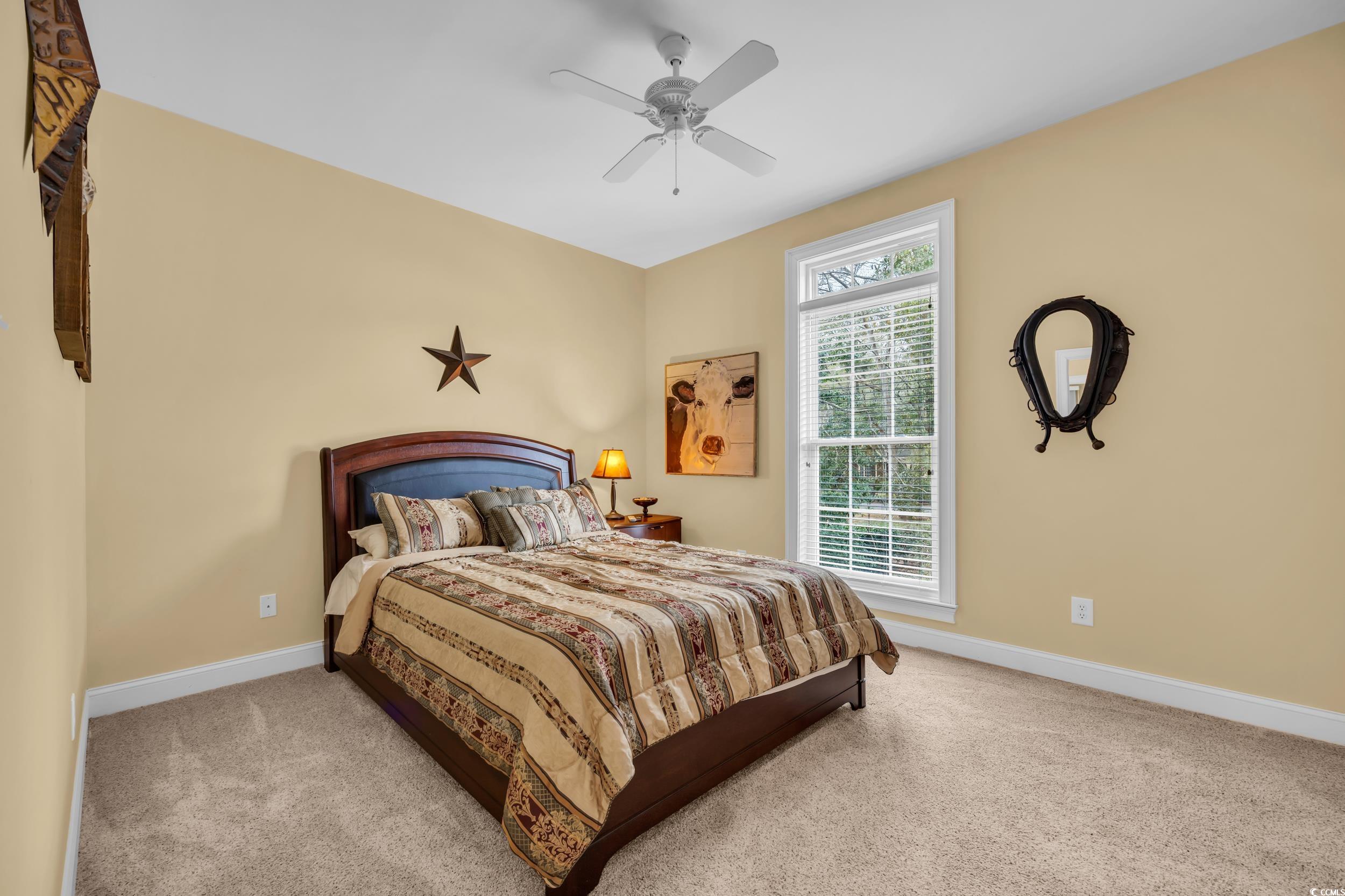 830 Channel Cat Cove Murrells Inlet, SC 29576 - Photo 16 of 40 Carpeted bedroom with ceiling fan