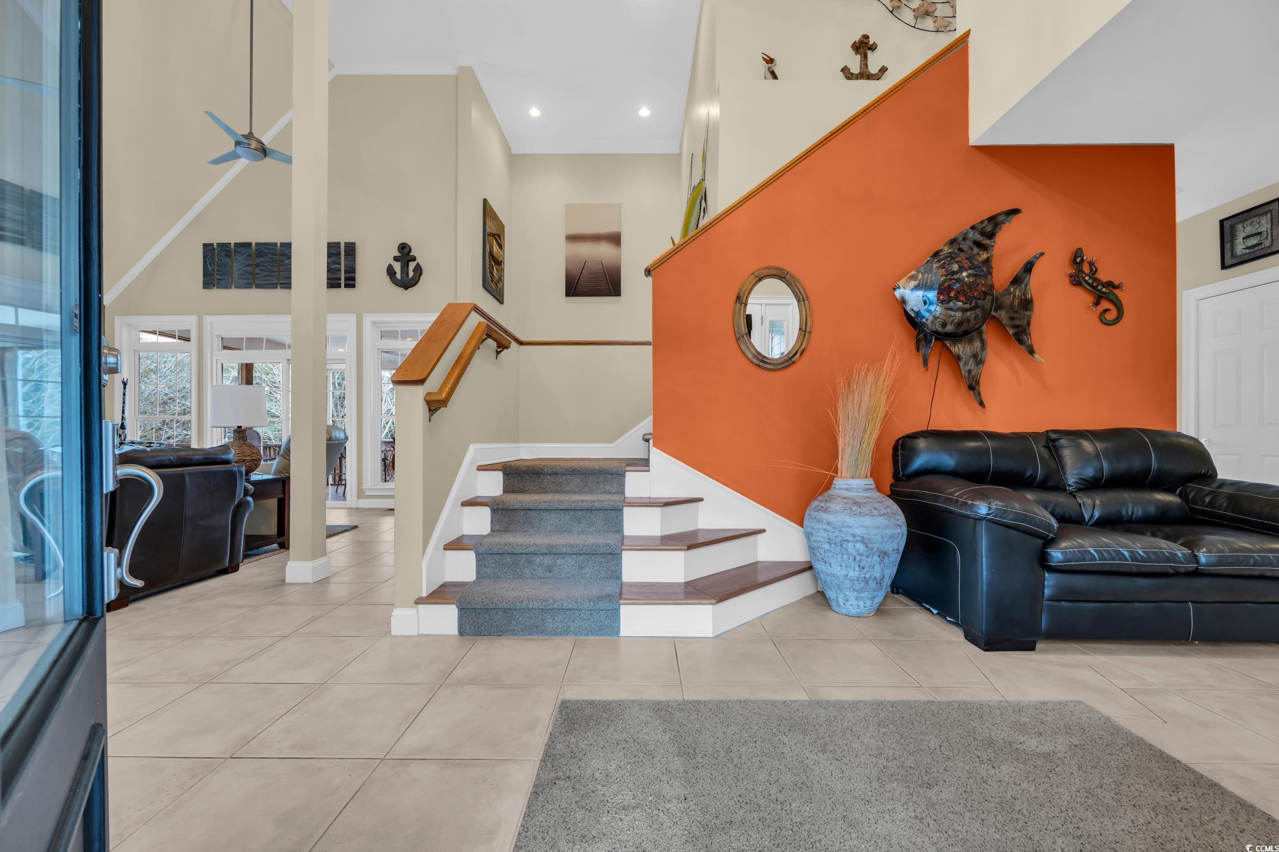 830 Channel Cat Cove Murrells Inlet, SC 29576 - Photo 7 of 40 Interior space with tile patterned flooring, ceiling fan, and a high ceiling