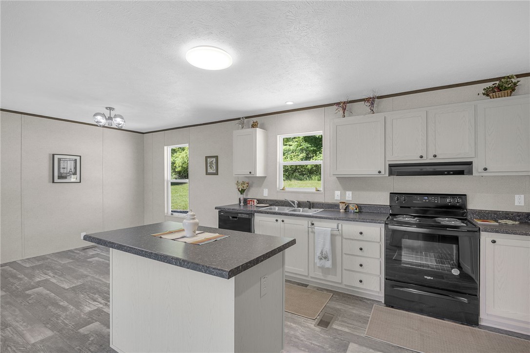 375 Griggs Road Six Mile, SC 29682 - Photo 11 of 36 This spacious kitchen features ample counter space, modern appliances, and a convenient kitchen island.