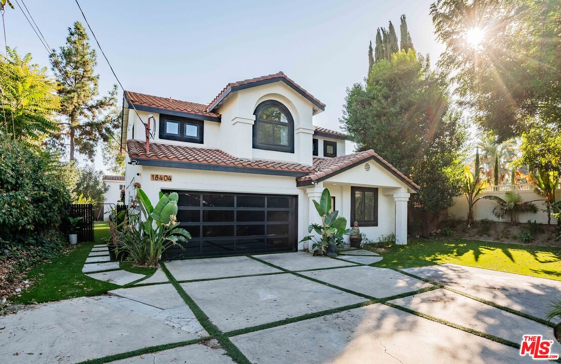 18404 Arminta Street Reseda, CA 91335 - Photo 2 of 13 a view of a house with a swimming pool and a yard