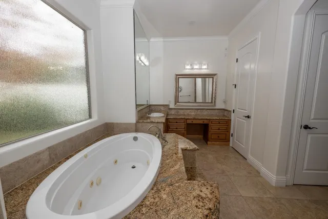 a bathroom with a bathtub and a sink
