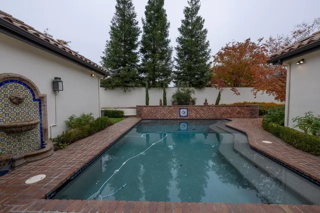 a view of swimming pool from a balcony
